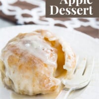 Apple dumpling on plate with fork. Text overlay says Fall Apple Dessert