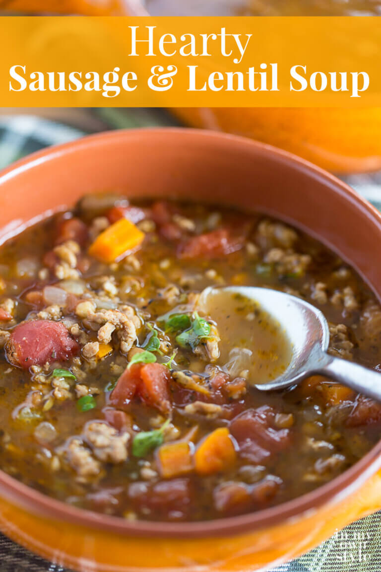 Bowl of Sausage and Lentil soup being spooned out. Text overlay says Hearty Sausage and Lentil Soup