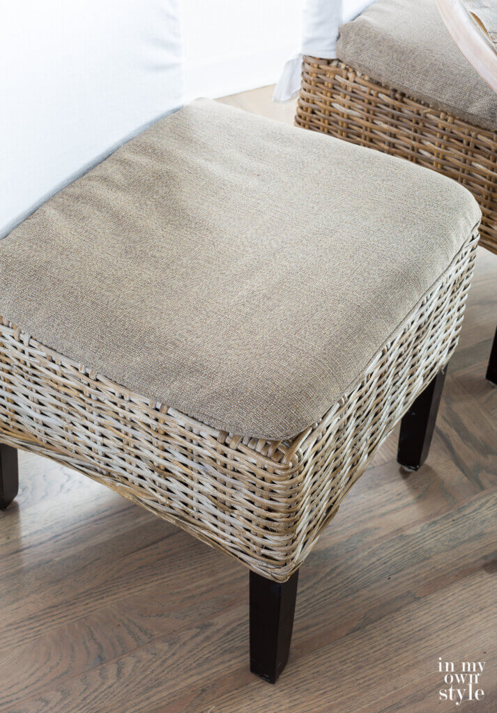 Driftwood colored rattan dining chair covers made by repurposing an item that was broken and headed for the trash.
