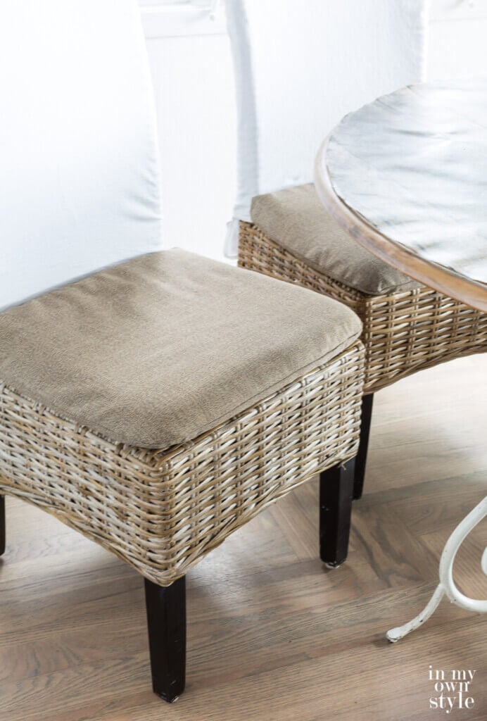 Driftwood colored rattan dining chair covers made by repurposing an item that was broken and headed for the trash.