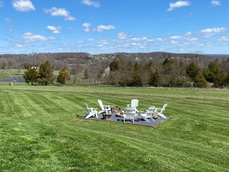 firepit in large yard with sweeping view