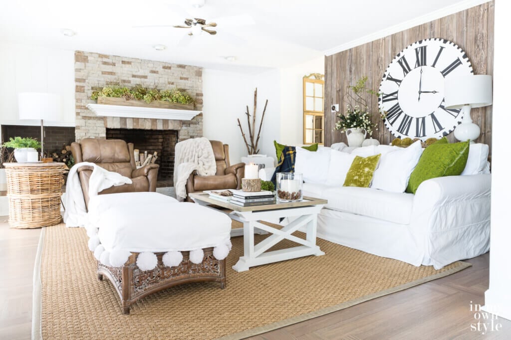 Autumn decorated living room using items from nature to create a white and woodsy look.