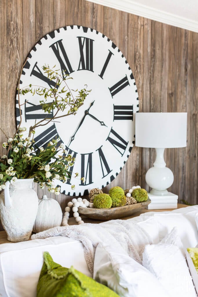 Living room decorated for fall using brown and green color scheme.