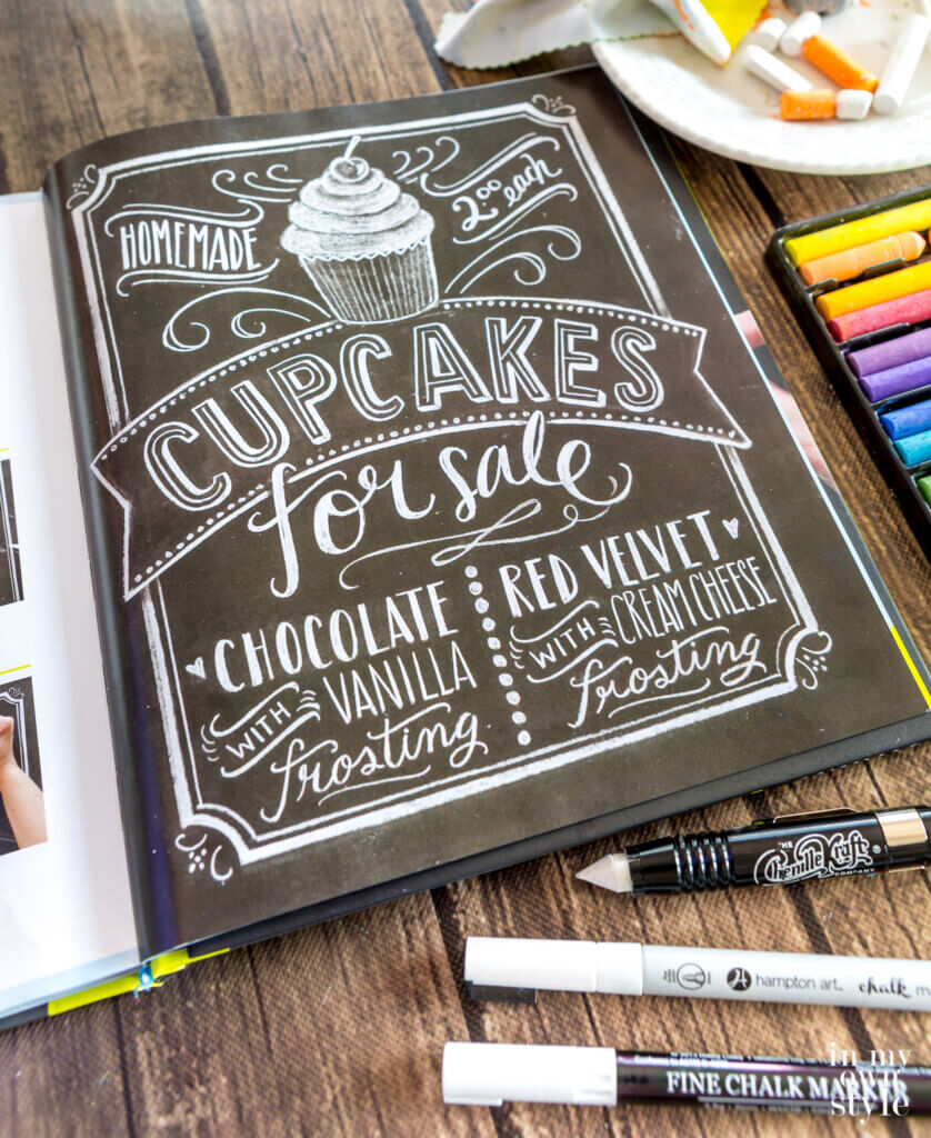 Open copy of the book The Complete Chalkboard Lettering Guide