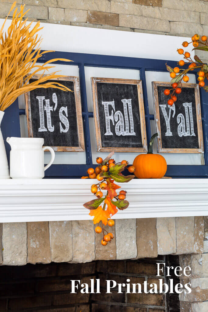 Free Fall Printables It's Fall Y'all on a white mantel with fall decorations around it.