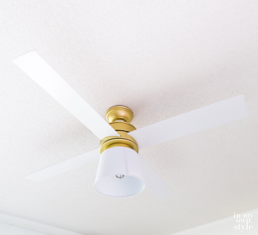 Hunter Hepburn ceiling fan in white with DIY replacement globe made using a lampshade.