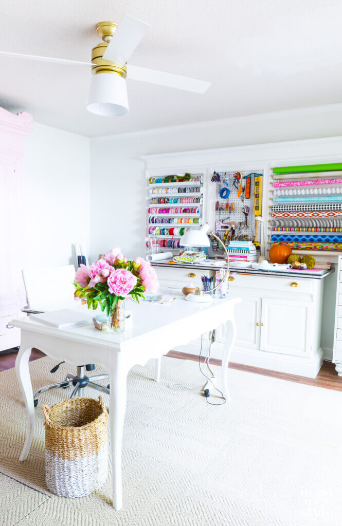Craft room with Hunter Hepburn ceiling fan with lampshade to replace broken glass globe.