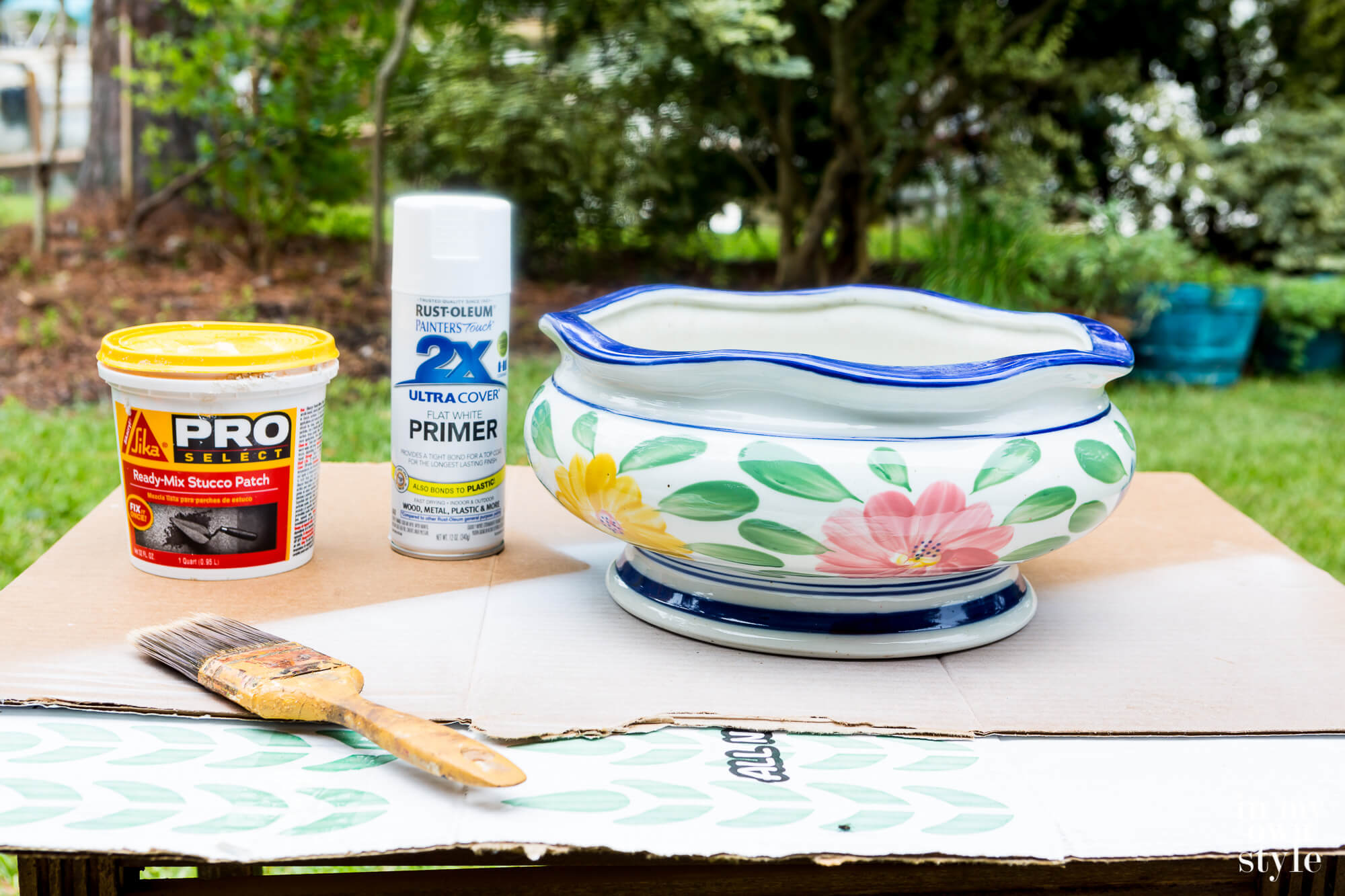 Large Decorative Bowl with flower pattern before getting a aged paint finish using stucco paste.