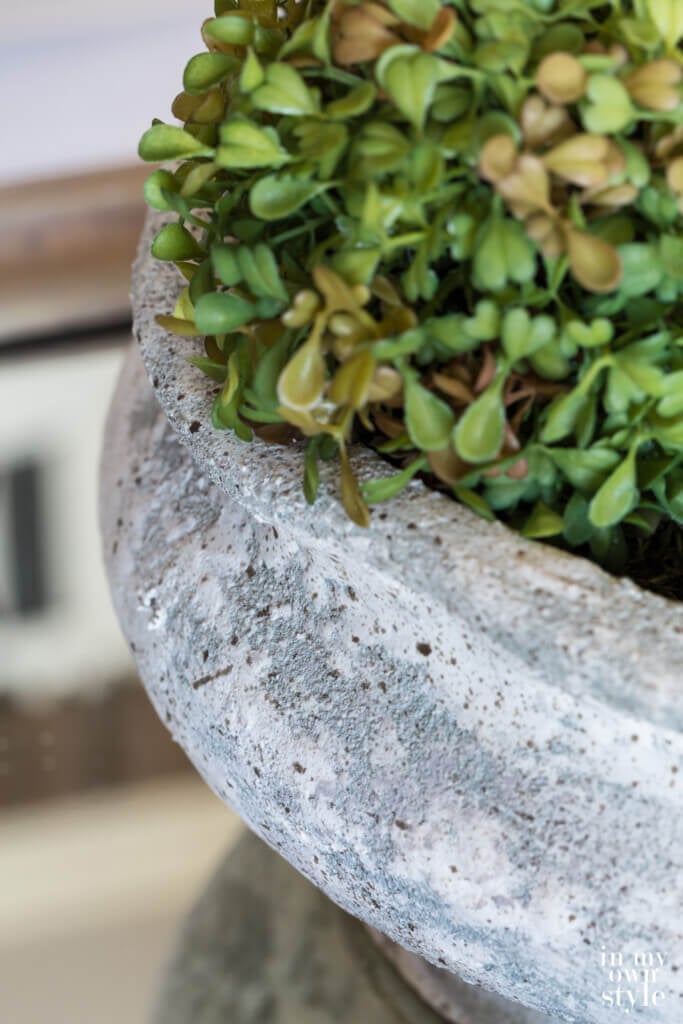 Close up shot of planter after it got a makeover to make it look like aged concrete.