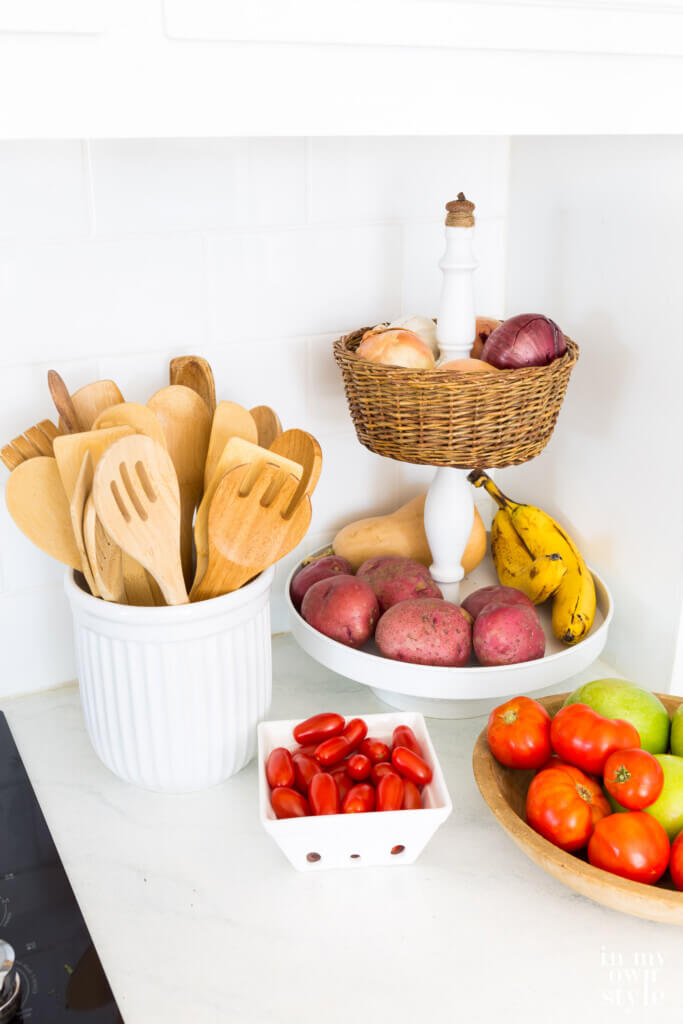 Tiered kitchen basket to make to store fruit and produce on a counter.