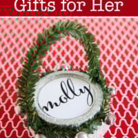 Pint sized Mason jar turned into a cute Christmas gift bag. Text overlay says Mason Jar Gifts for Her.