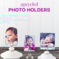 3 teapot lid and jar lid photo holders lined up on a table. Text overlay says no frame needed upcycled photo holders.