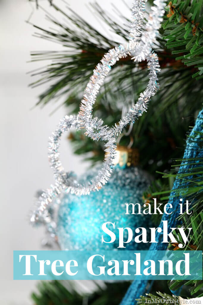 Christmas decorating on a budget. Sparkly silver pipe cleaner Christmas tree garland to make. Fast and affordable Christmas decor. ideas. Text overlay say make it Sparkly Tree Garland