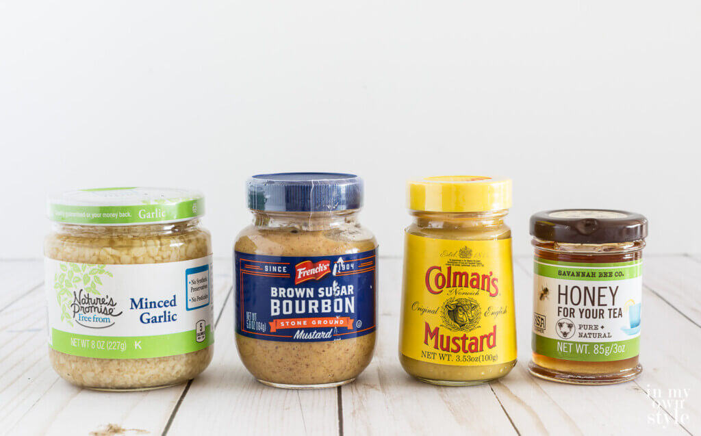 4 small glass food jars lined up.