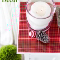 Sideboard decorated for Christmas on a budget using gift wrap.