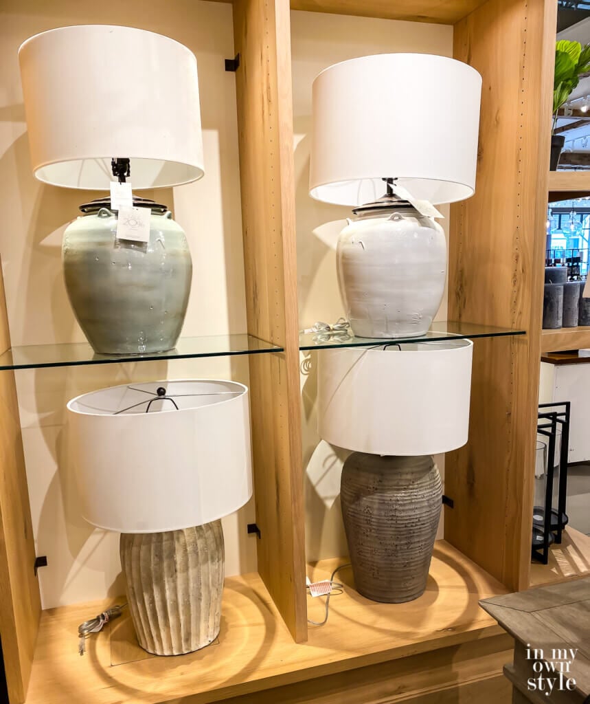 4 table lamps on display at a Pottery Barn store.