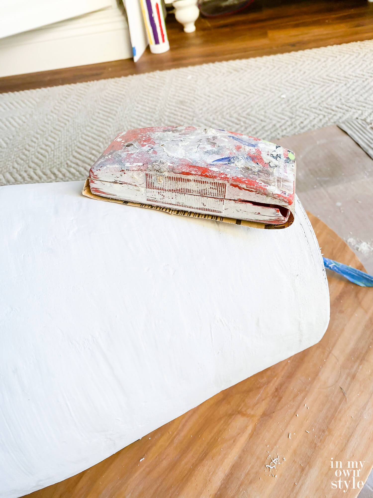 Sanding block to smooth spackle on lamp