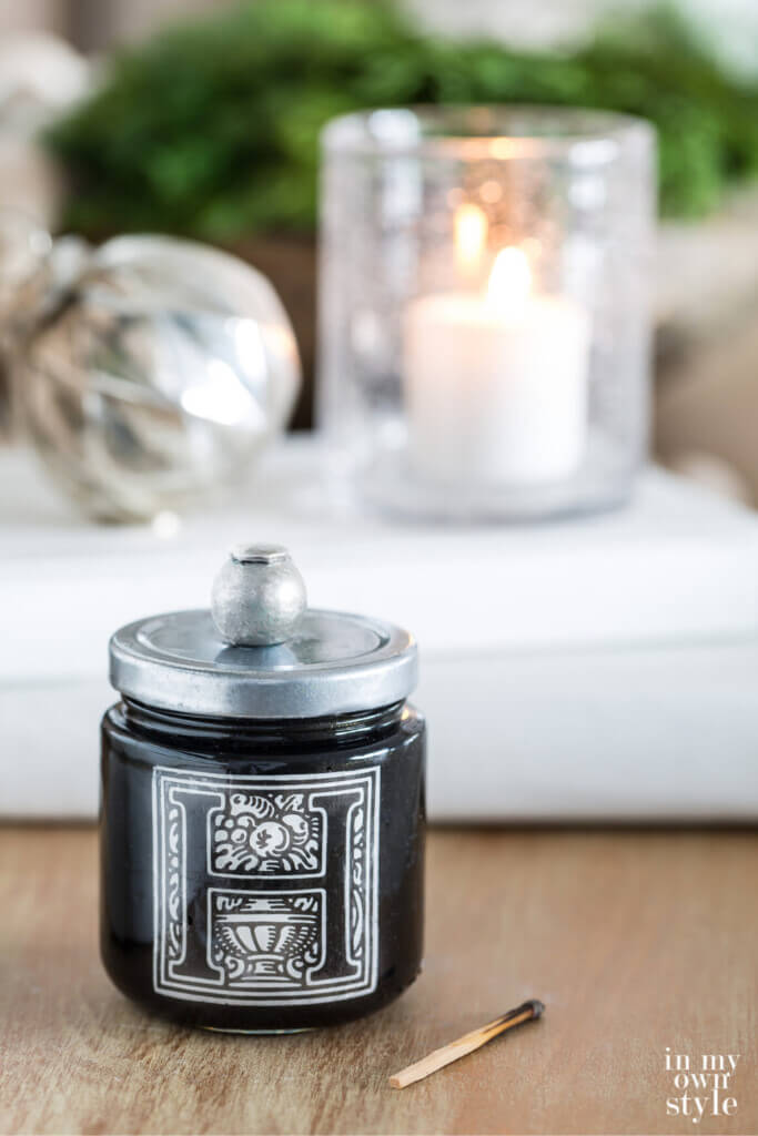 Handmade Match jar with striker on table.