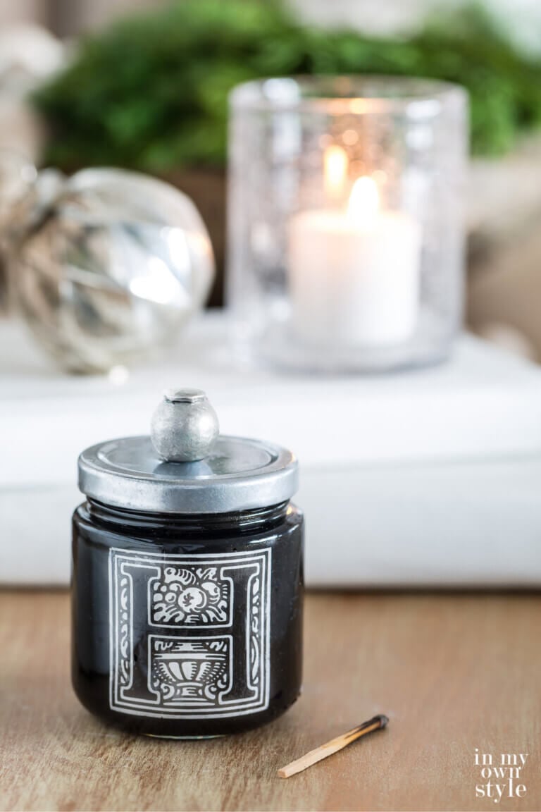 Handmade Match jar with striker on table.