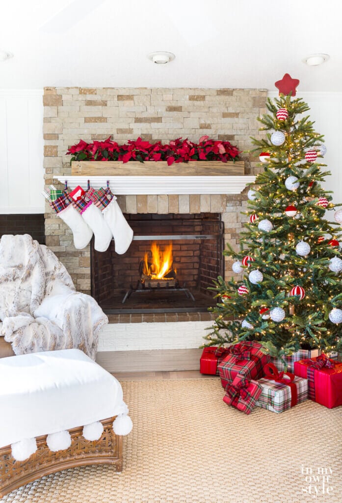 Mantel in living room decorated for Christmas