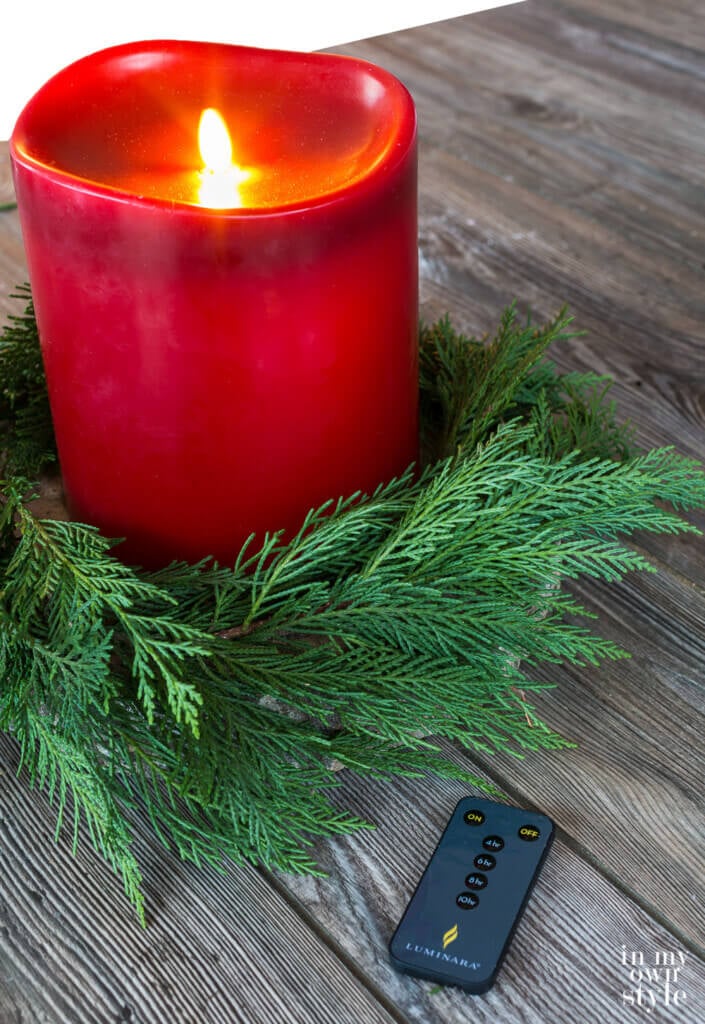 Christmas table wreath ideas. Use a large red pillar style battery operated candle on table.