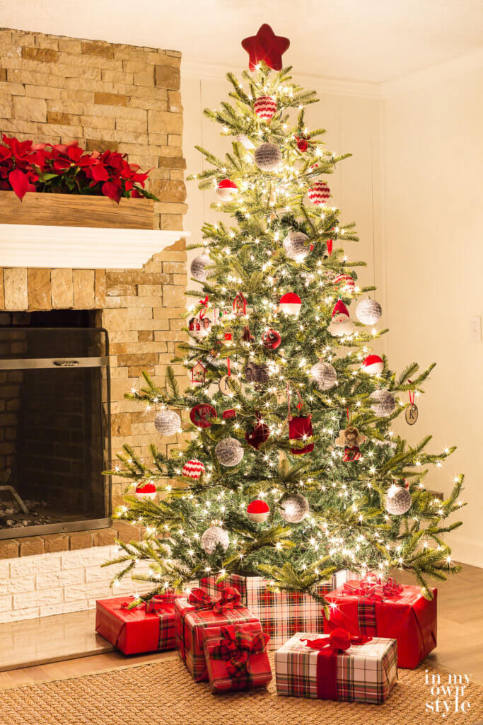 Christmas tree lit at night adds glow to the room.