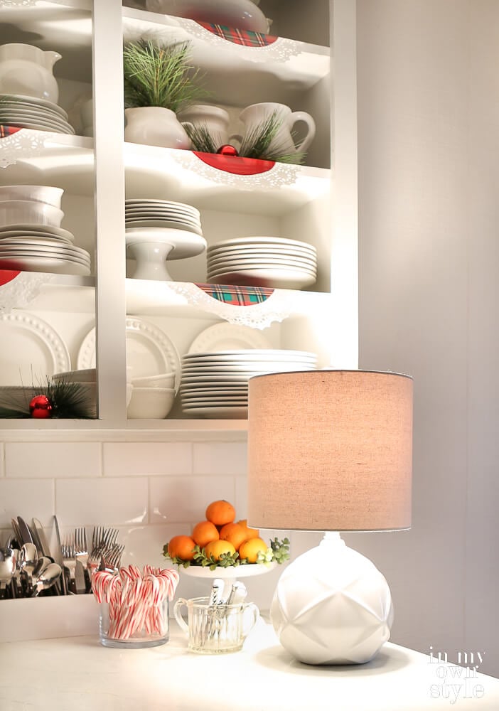 Small table lamp on kitchen counter to add warm and cozy feel.