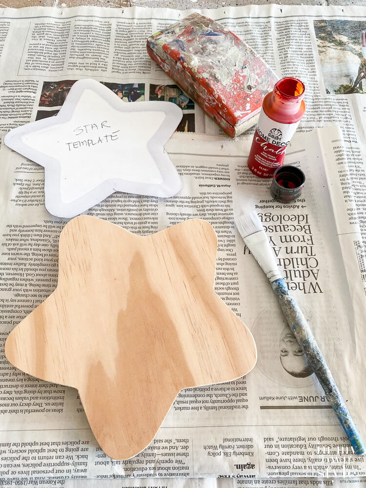 supplies needed to make a wood star topper for a Christmas tree.