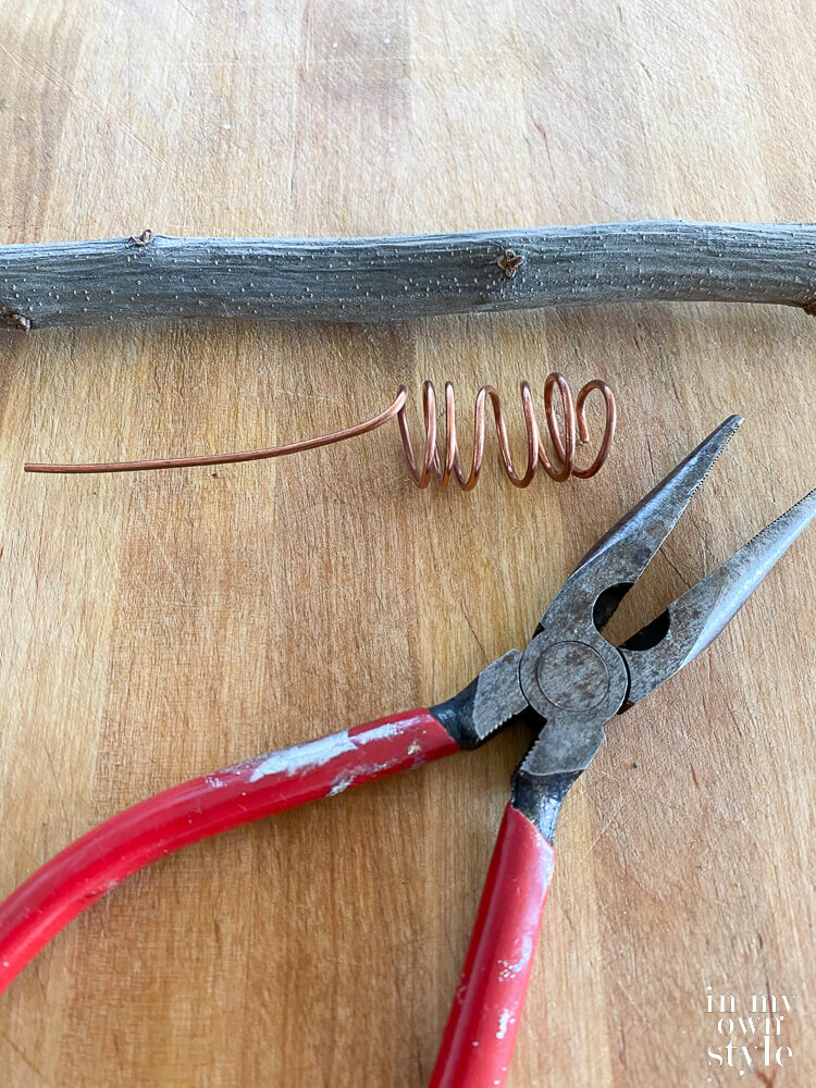 Tools needed to make make wrapped wire to attach a Christmas tree topper.