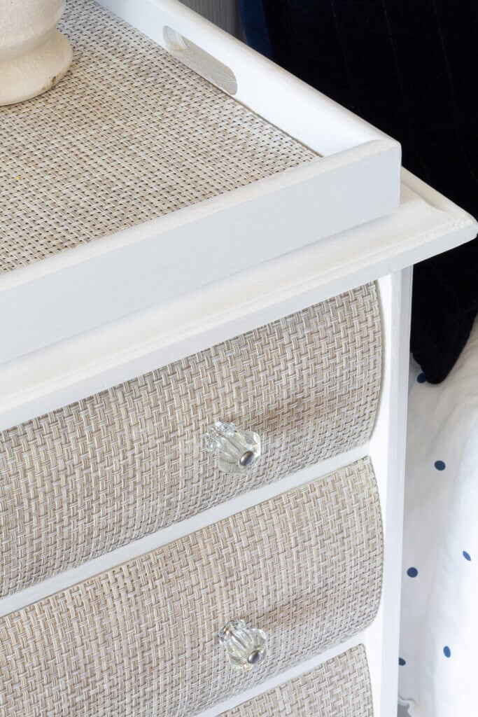 placemat in tray on woven drawer fronted nightstand