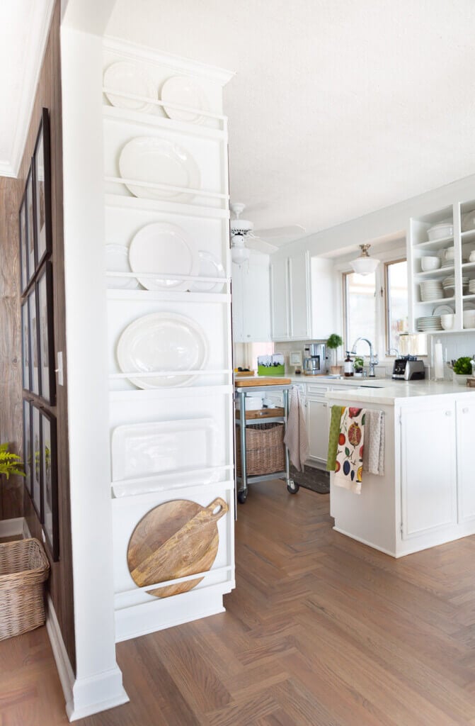 Plate rack wall is in between living room and kitchen.