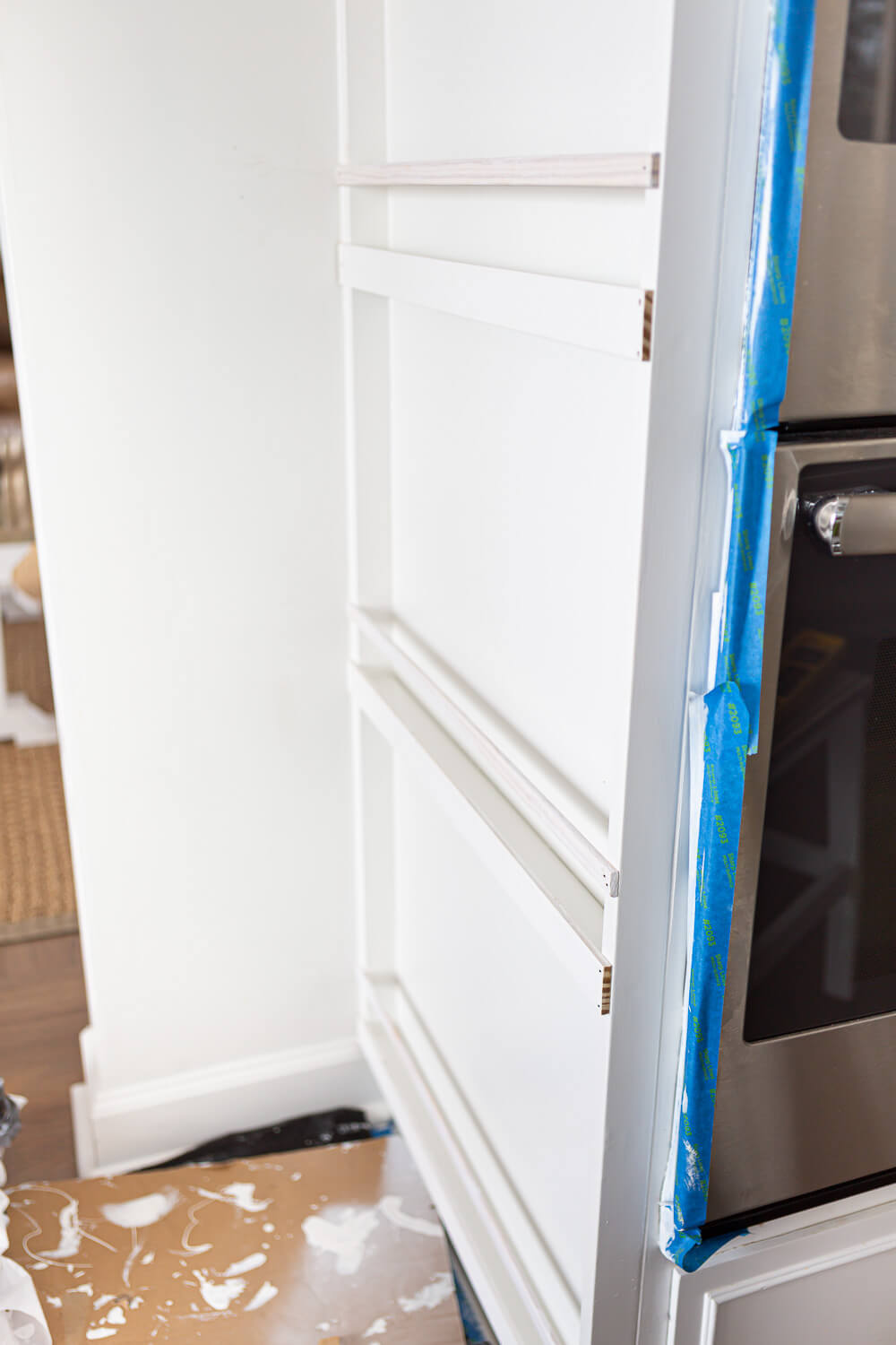 Building a plate rack on a narrow wall in a kitchen.