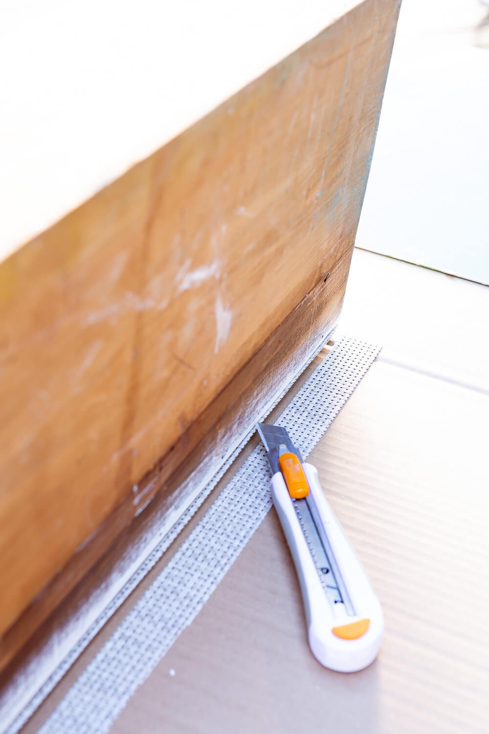 cutting excess placemat from drawer