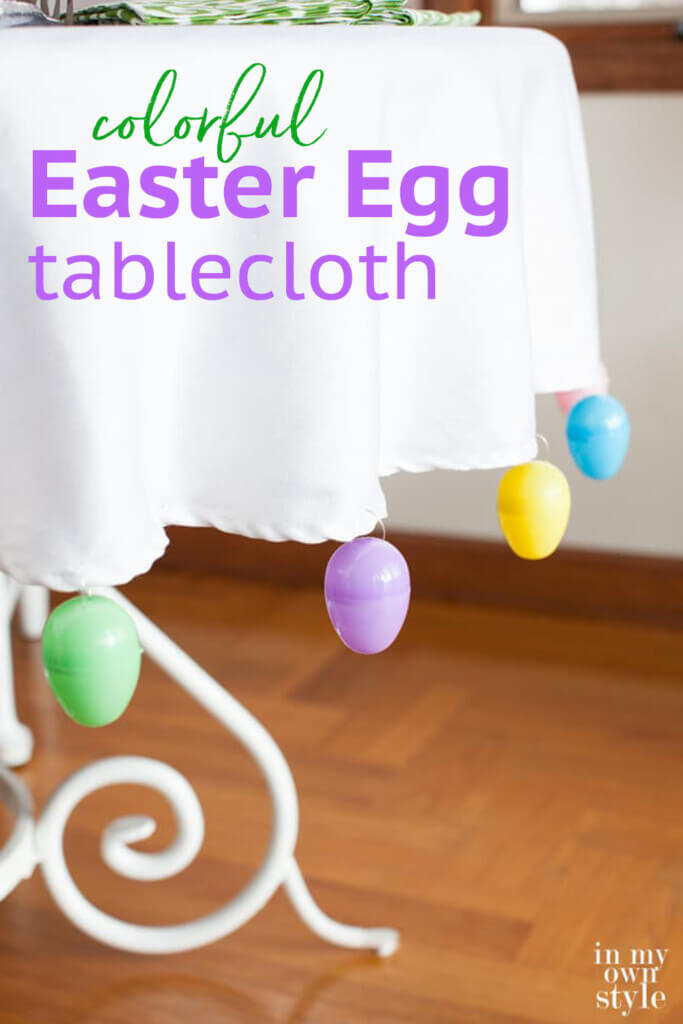 Easter decor table idea. Text overlay says colorful Easter egg tablecloth.