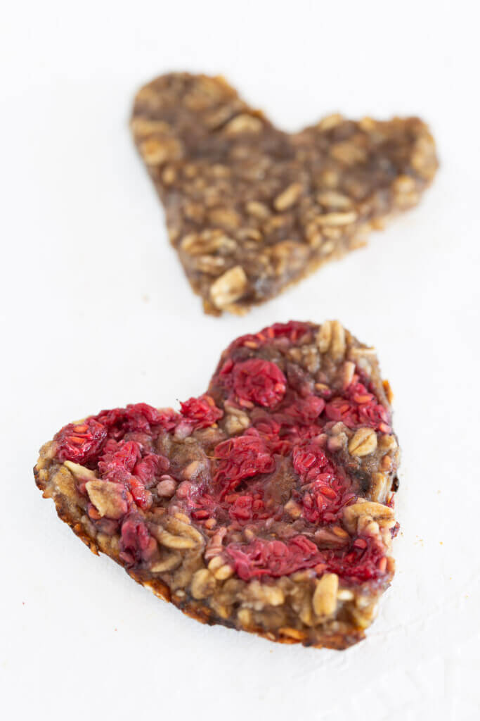 two flat heart shaped banana oatmeal cookies