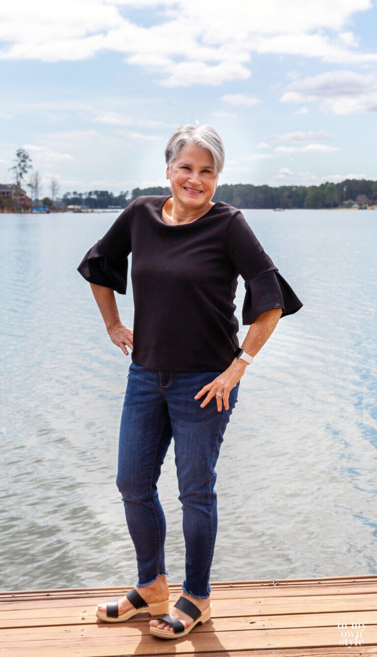 Diane blogger at In My Own Style on lake dock.