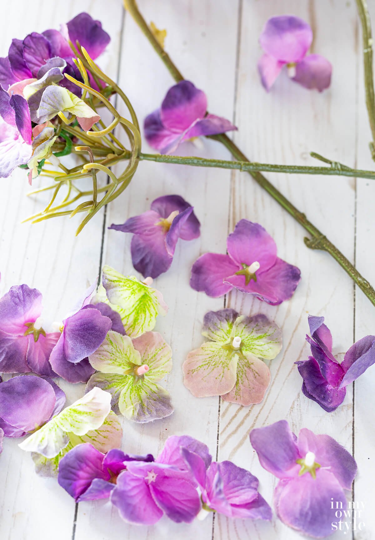 Faux flower petals snipped from the head of faux flower head.