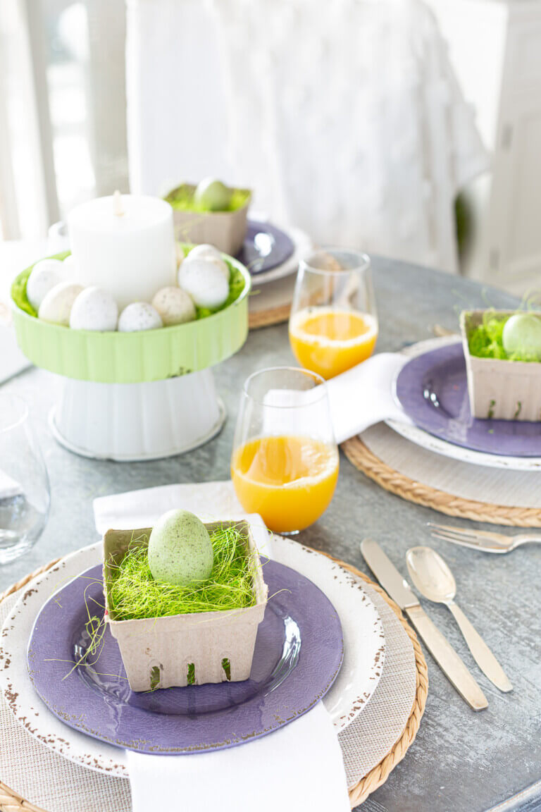 Easter Brunch table decorations. Purple, pale green and white spring color theme..