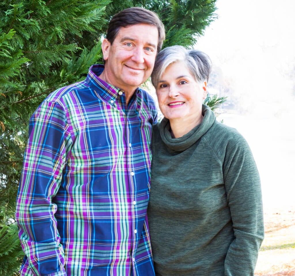 Photo of Ed and Diane blogger of In My Own Style outside by a tree.