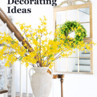Yellow flowers in large vase on foyer console table. Text overlay says Foyer Decorating ideas that say Hello Spring