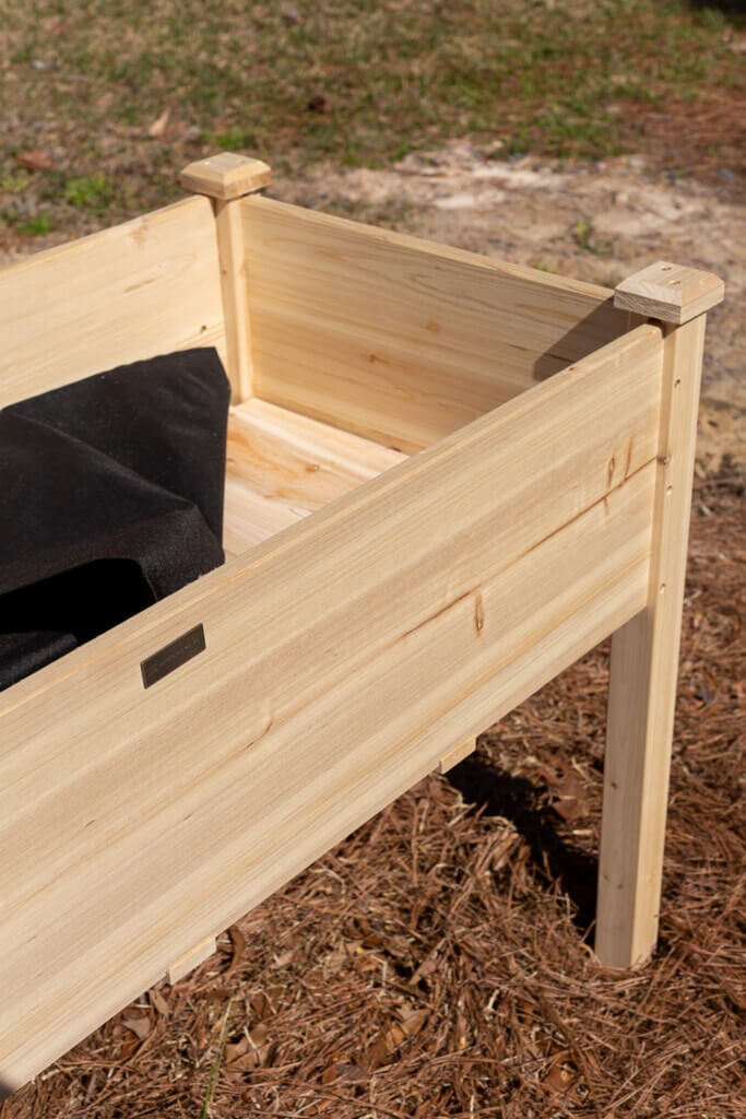 Close up of the inside of an assembled cedar elevated planter box.