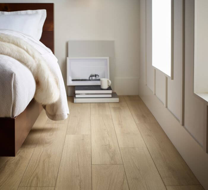 Wide natural planks. Shaw Luxury Vinyl Plank flooring in a bedroom.