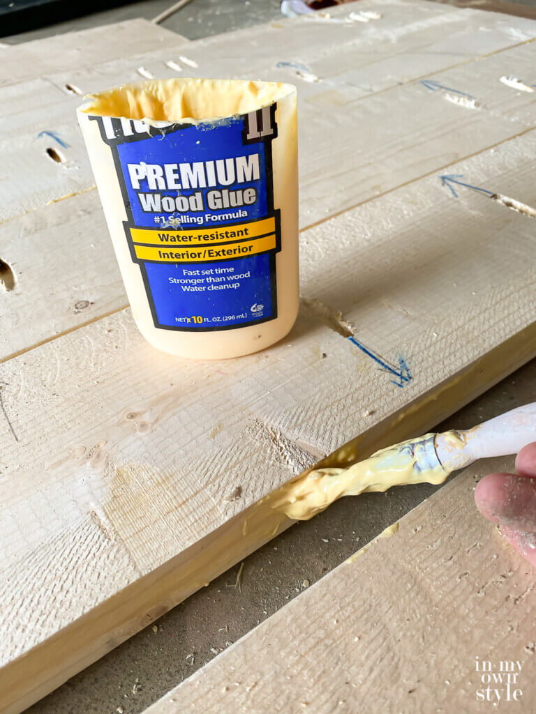 Add wood glue between each board before installing pocket hole screws