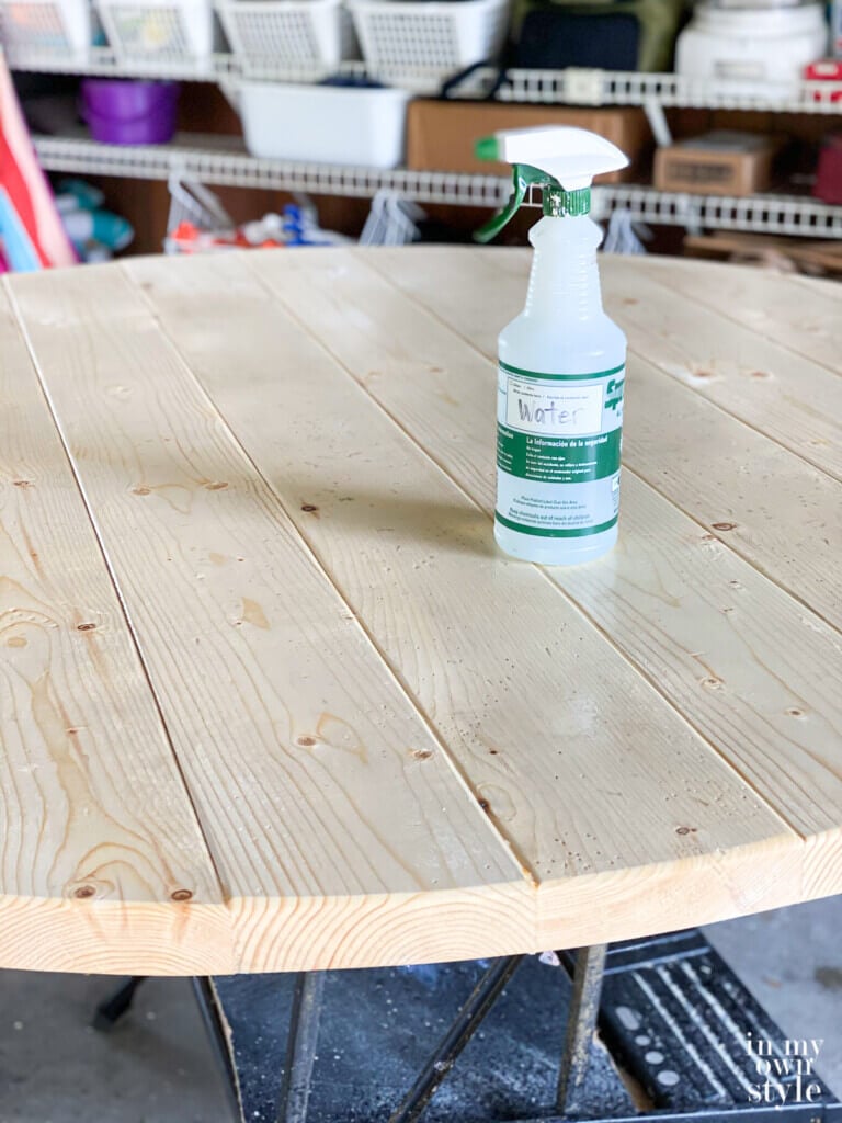 spray water on pine boards if using water-based products