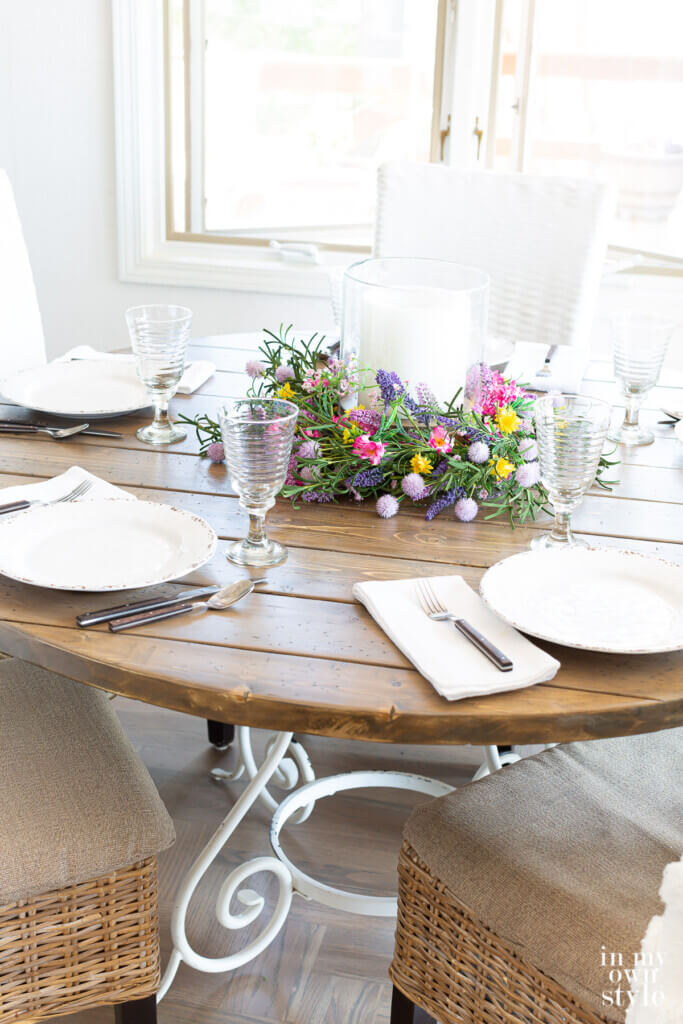 Completed DIY round wood table top set for dinner.