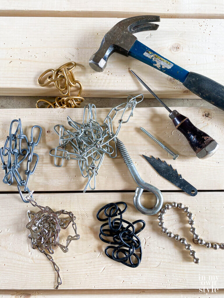 Items to use to distress boards to make new wood look old.