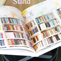 DIY Open Book Stand on coffee table with opened book being displayed on it.