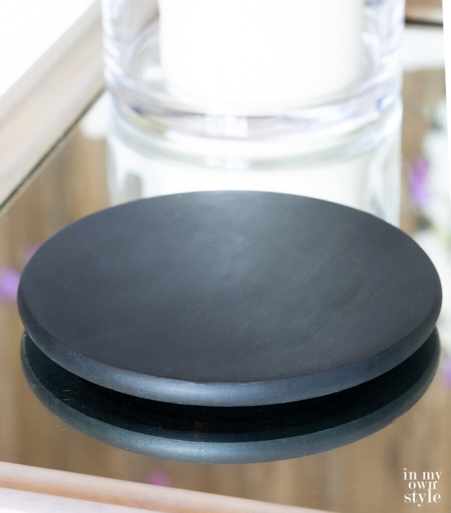black painted wood turntable to hold x shaped open book stand.