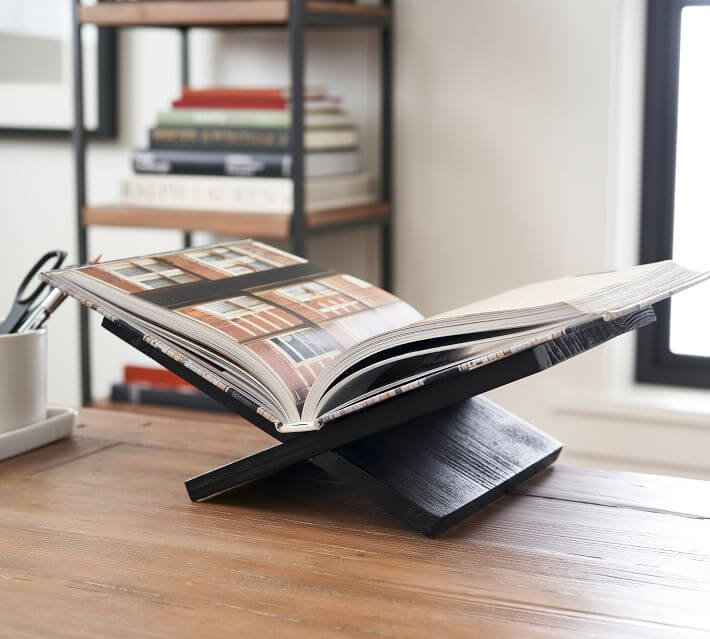 Pottery Barn Open book display stand on table.