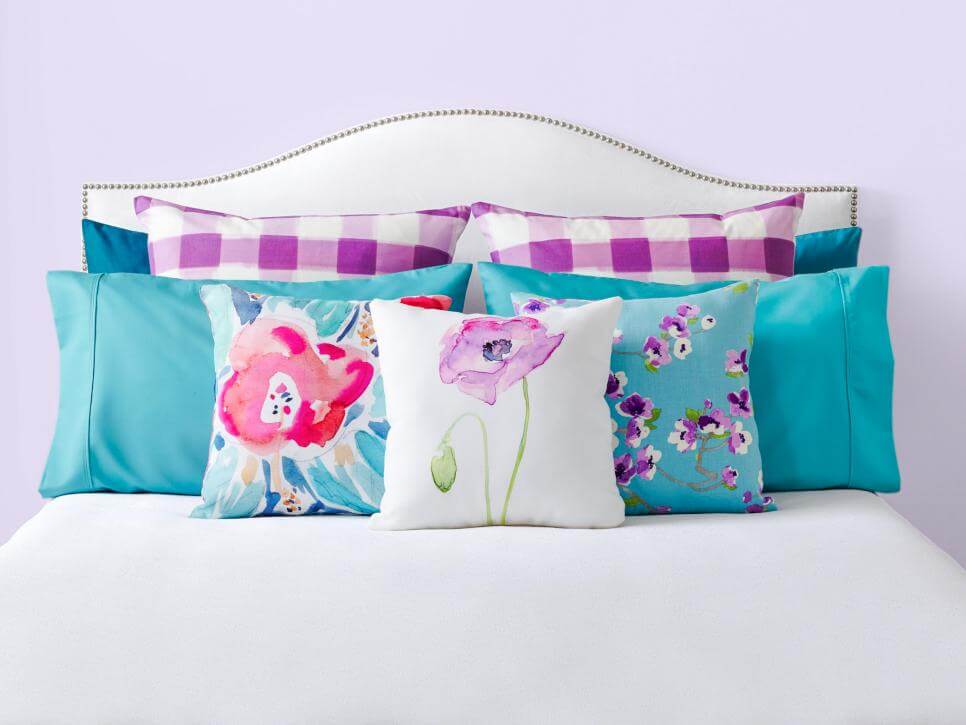 Pillow styling ideas for beds using a lot of decorative pillows.